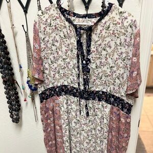 Boutique floral dress with neck tie and smocked waist.